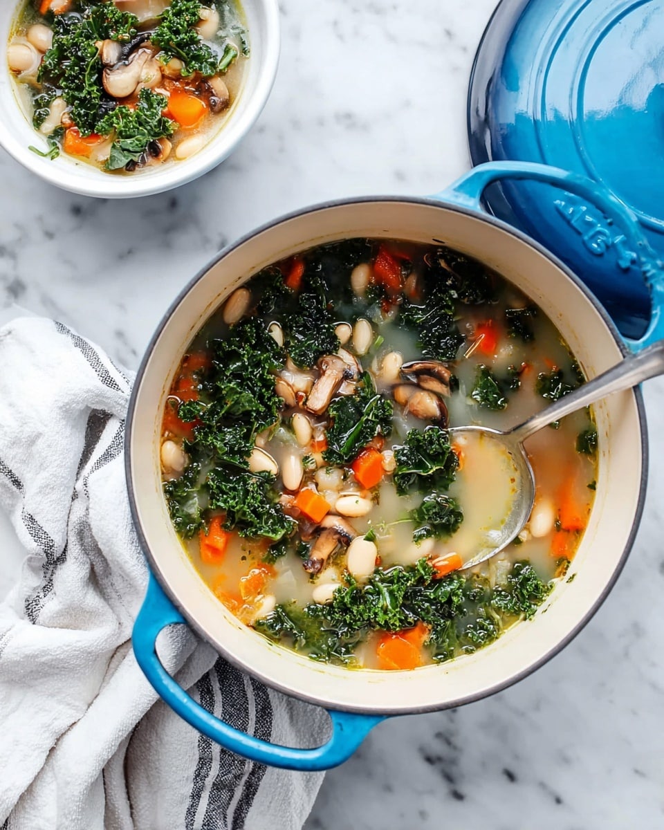 The image shows a large white pot filled with creamy soup that has visible layers of green kale, orange carrot pieces, light beige beans, and slices of brown mushrooms floating in the broth, placed on a white marbled surface. Two white bowls are nearby filled with the same soup, one of which has a spoon inside. The bowls reveal the same layers and mix of ingredients. Around the scene, there are two glasses with a light liquid, a light-colored linen cloth, green parsley sprigs, a small plate holding a cut lemon, and a round bread loaf with seeds on a wooden board. photo taken with an iphone --ar 4:5 --v 7