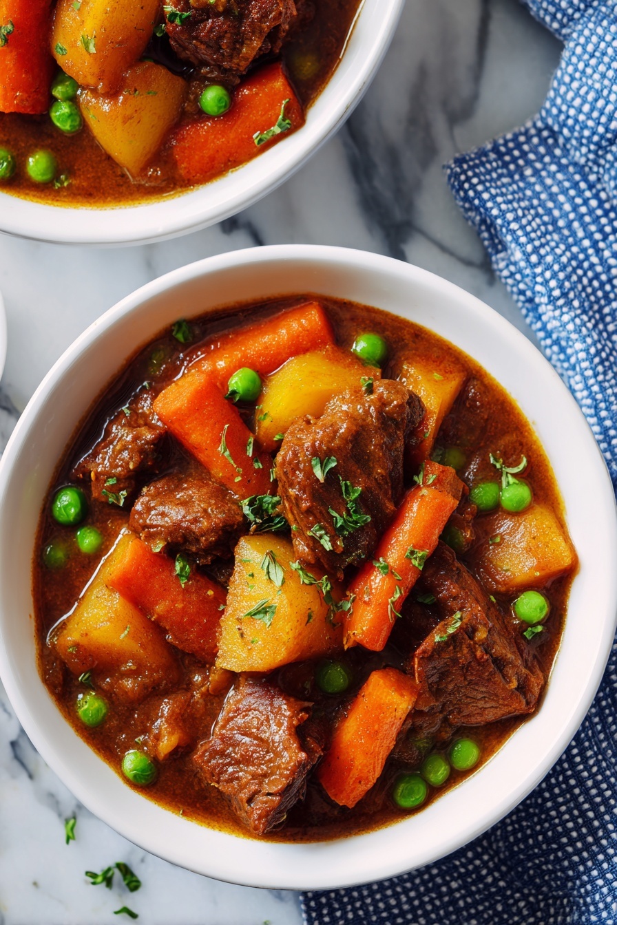 Instant Pot Beef Stew, beef stew recipe, easy beef stew, hearty beef stew, quick Instant Pot meals - The image shows two white bowls filled with a thick brown stew. Each bowl has large brown chunks of meat, bright orange carrot slices, light brown potato pieces, and scattered green peas, all covered in a rich brown sauce. The bowls sit on a wooden surface with a blue and white dotted cloth nearby and a shiny silver spoon placed on the cloth. The stew looks hearty with chunky, colorful ingredients in a savory liquid. photo taken with an iphone --ar 2:3 --v 7