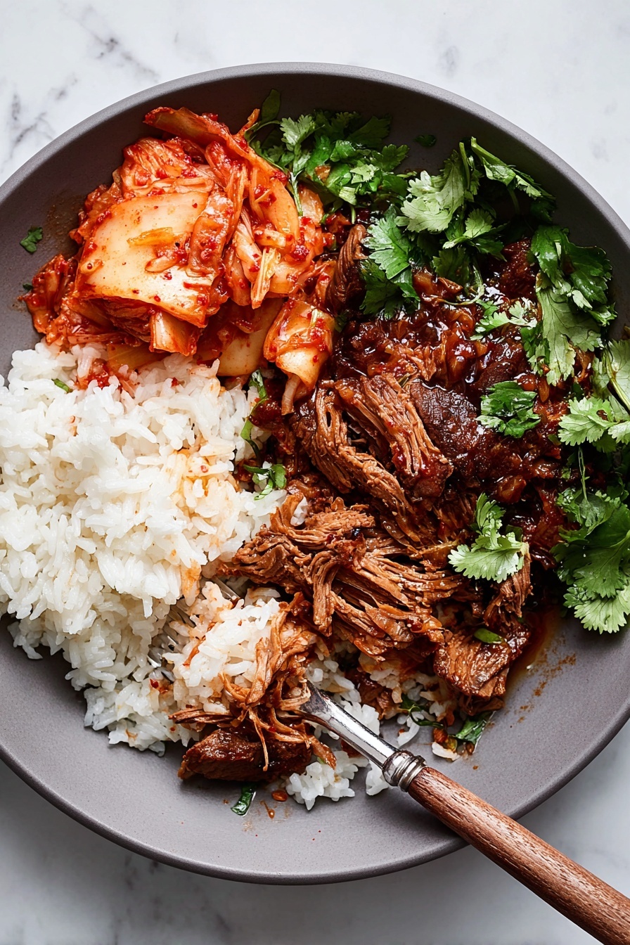 Korean Style Pot Roast, Korean inspired beef dish, tender beef stew, slow cooker Korean pot roast, easy Korean beef recipe - A white round plate holds three main parts: on the left, a pile of plain white rice with soft, separate grains; next to it, bright red-orange kimchi with wet, leafy textures; on the right, tender brown shredded meat covered with a thick dark brown sauce, some chunks held by a fork with a wooden handle resting on the plate; fresh green cilantro leaves scattered on top and around, all placed on a white marbled surface photo taken with an iphone --ar 2:3 --v 7
